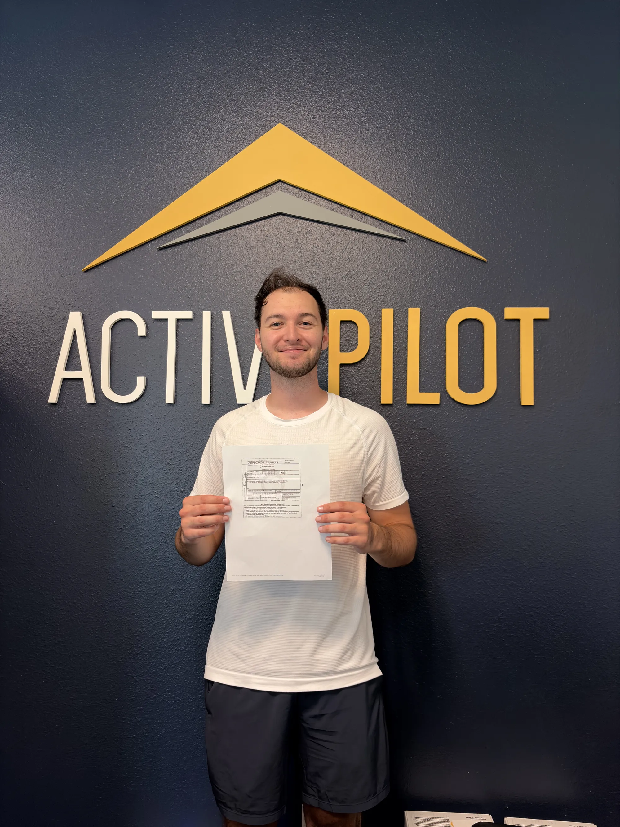 Francesco Pecile celebrating his commercial multi-engine add-on checkride pass at ActivePILOT