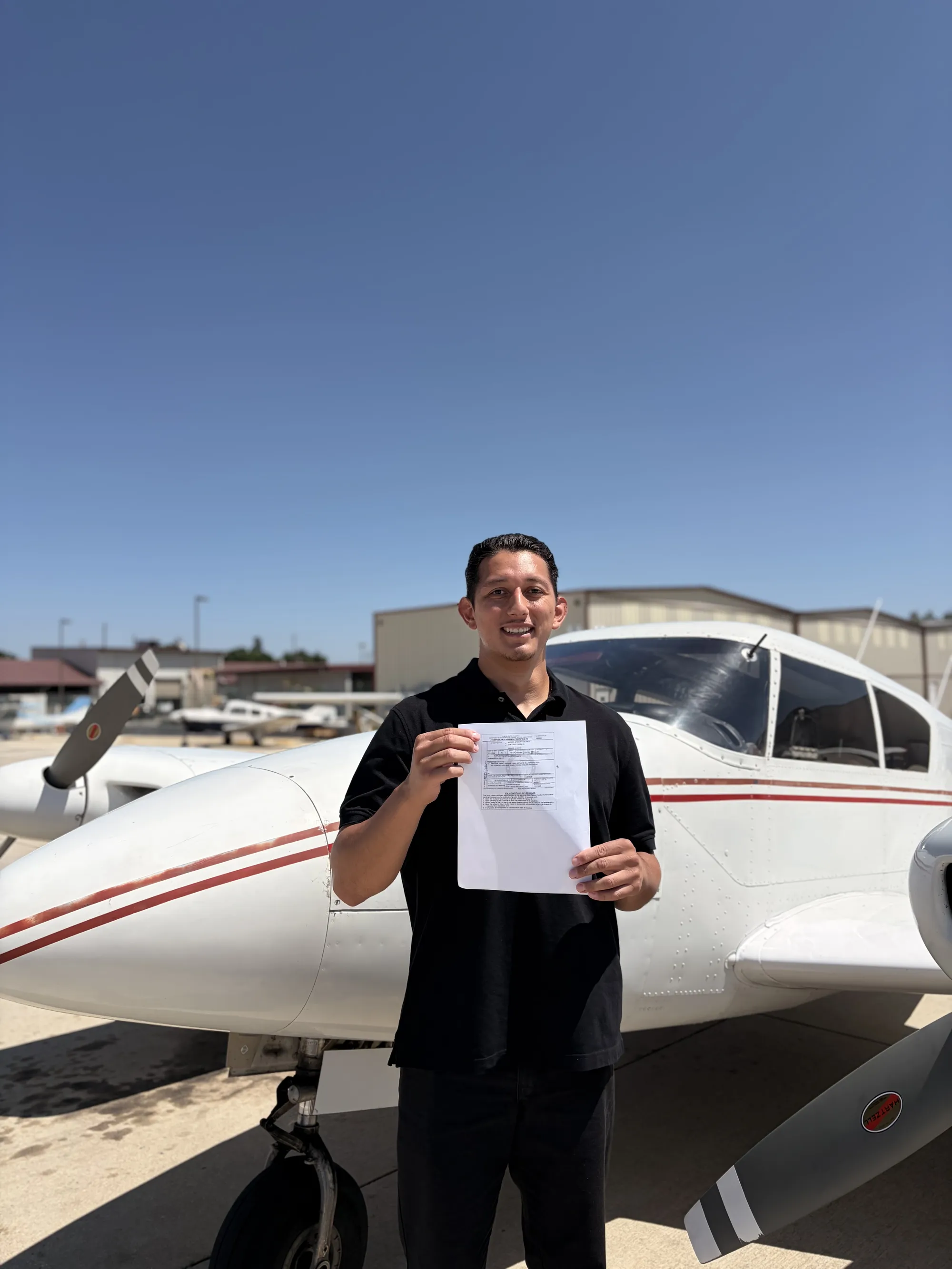 Michael Velasco celebrating his commercial multi-engine add-on checkride pass at ActivePILOT