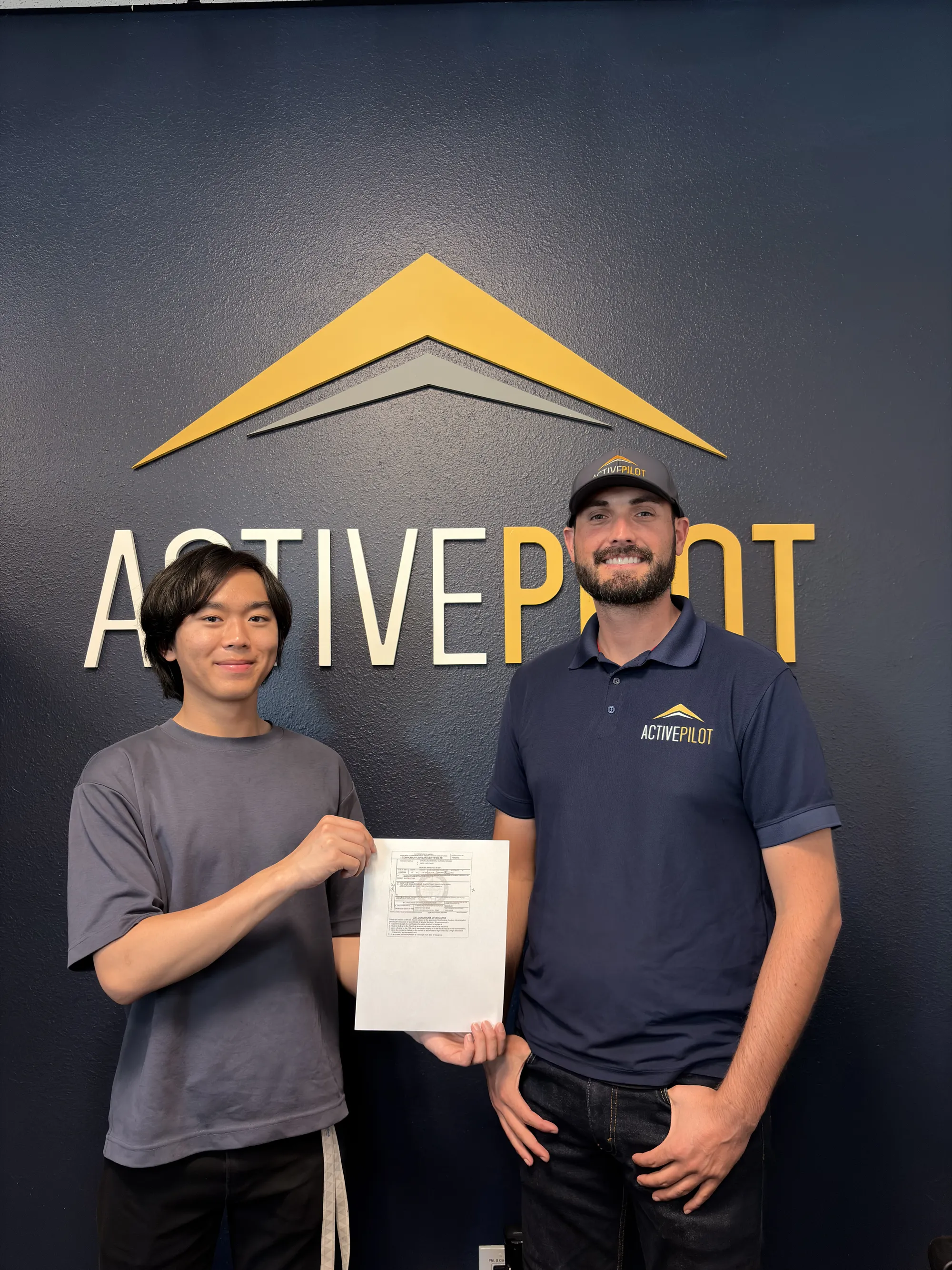 Shaun Okuda celebrating his initial certified flight instructor checkride pass at ActivePILOT