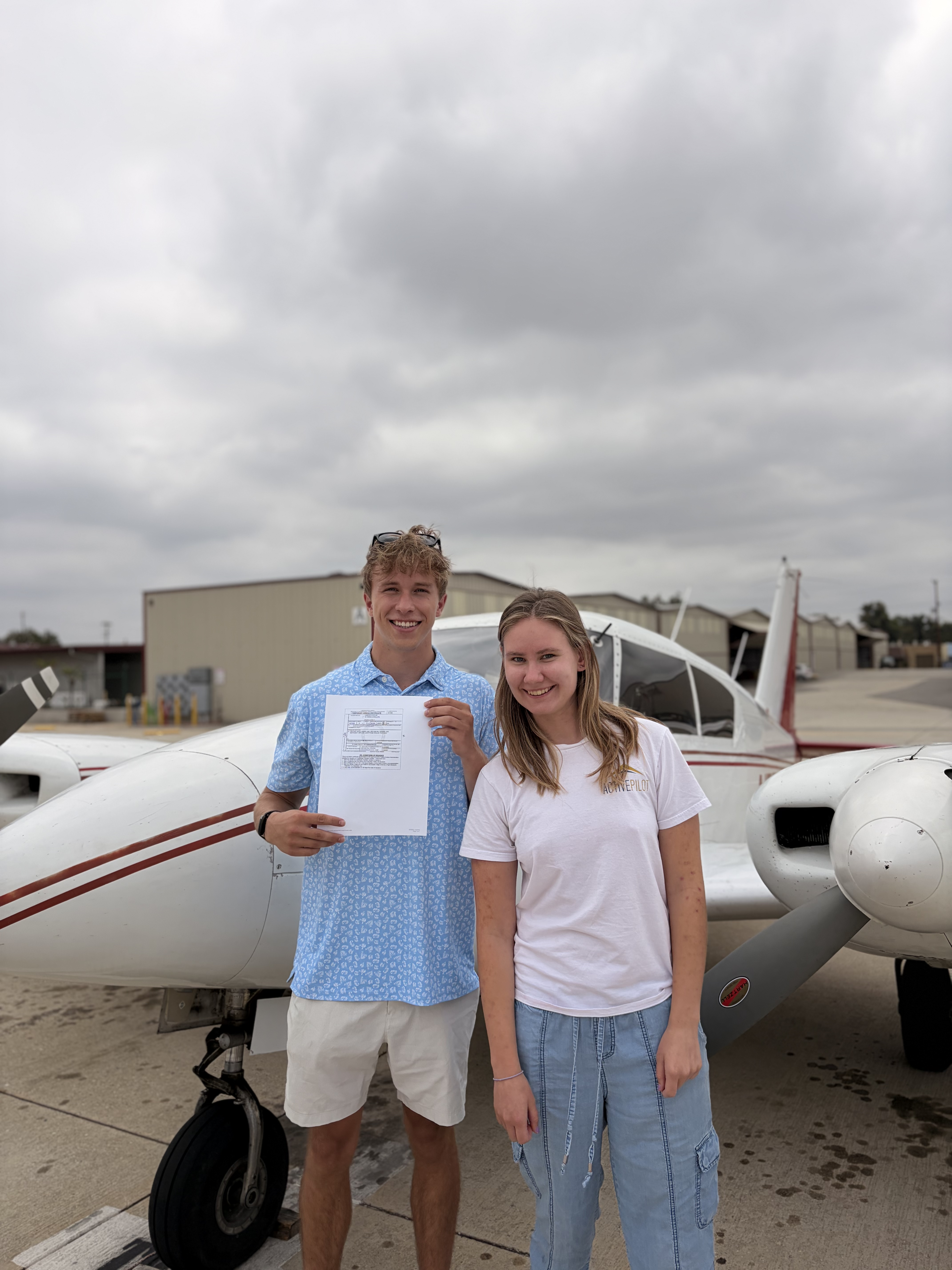 Cameron Lee celebrating his commercial multi-engine add-on checkride pass at ActivePILOT