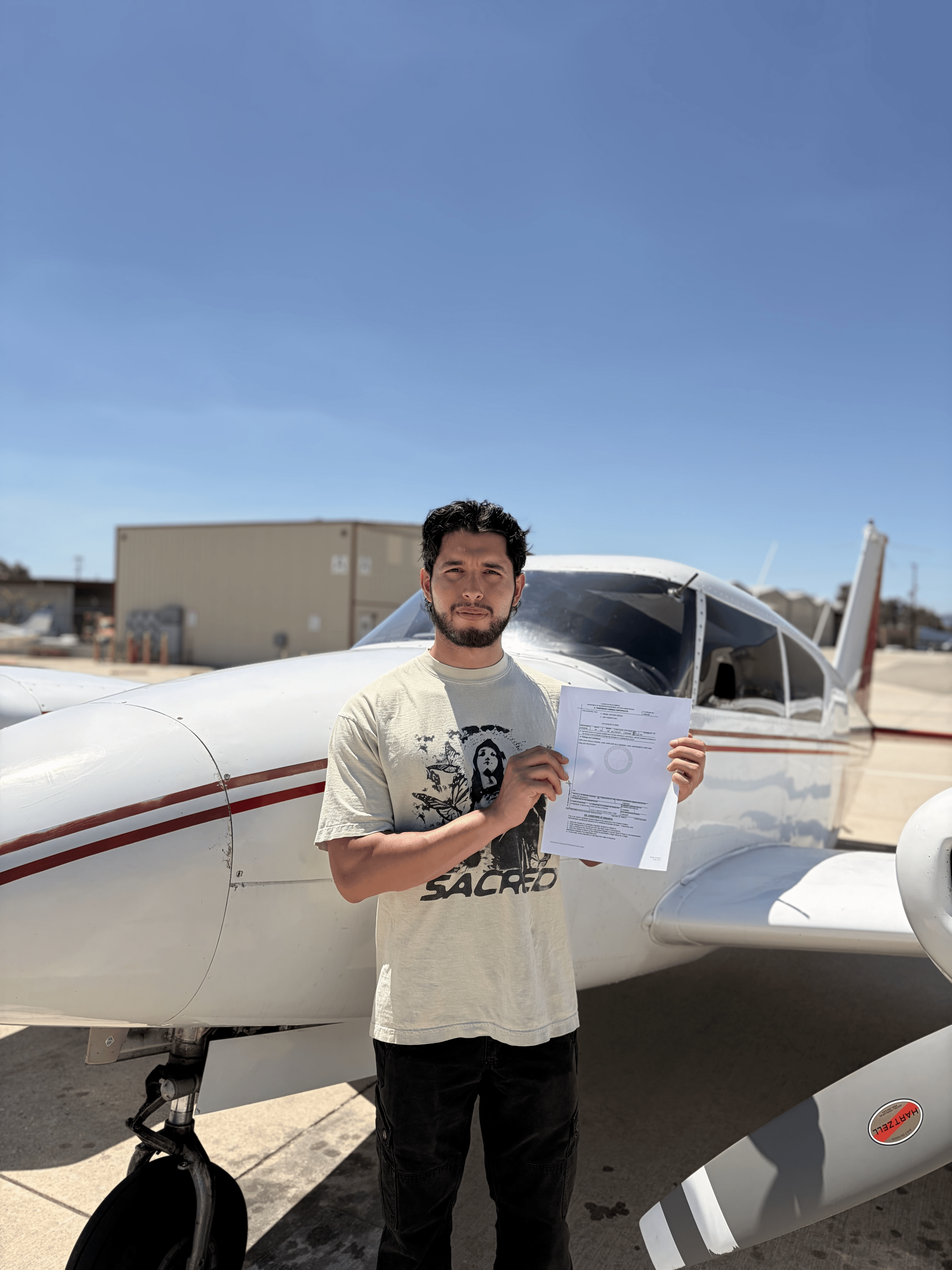 Ismael Deras celebrating his commercial multi-engine add-on checkride pass at ActivePILOT