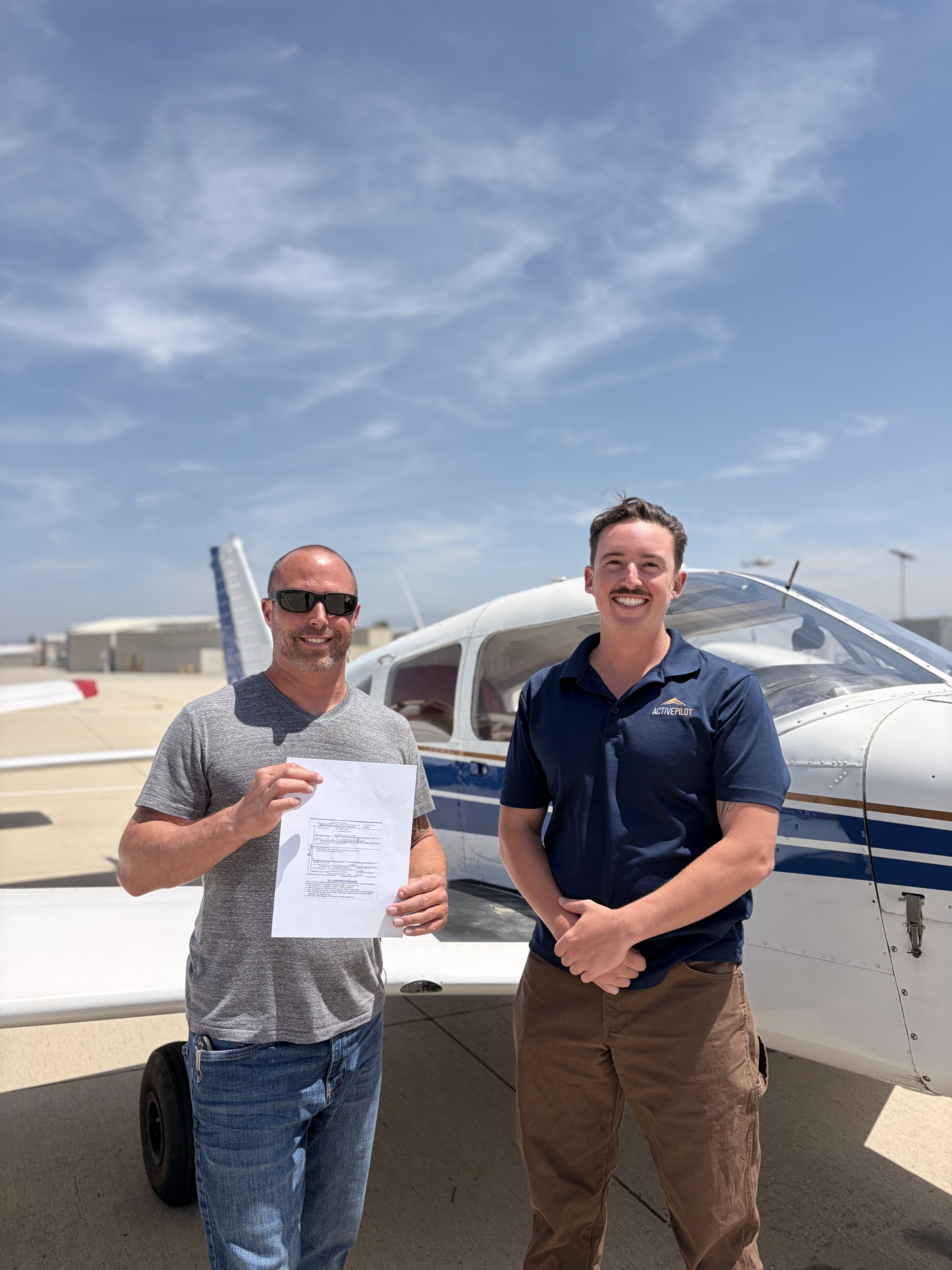 Lee Cooke celebrating his commercial pilot checkride pass at ActivePILOT