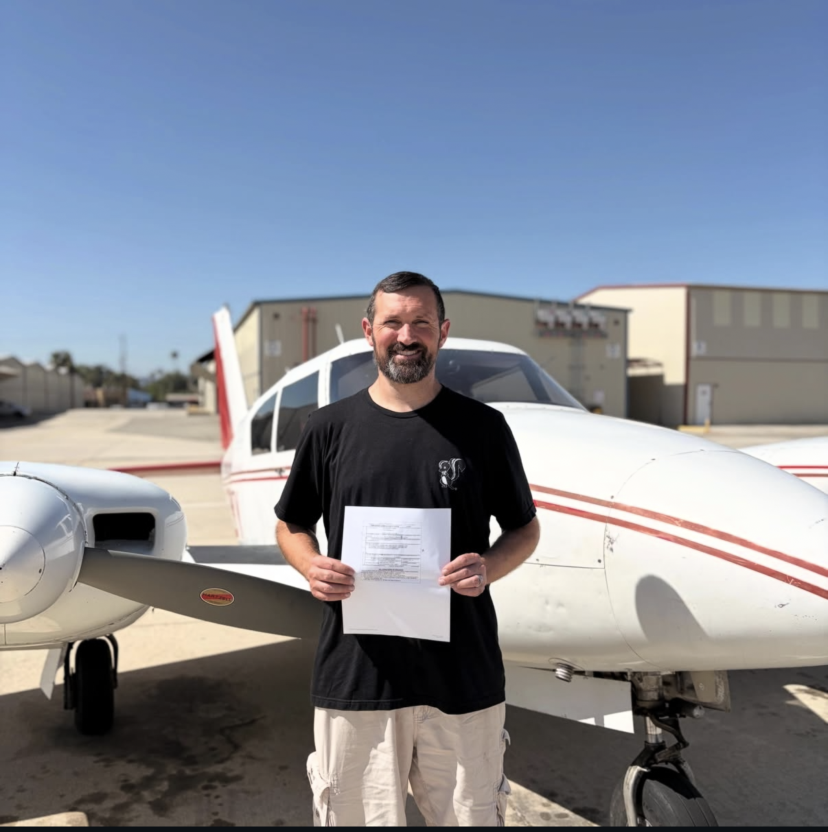 Sean Sundey celebrating his commercial multi-engine add-on checkride pass at ActivePILOT
