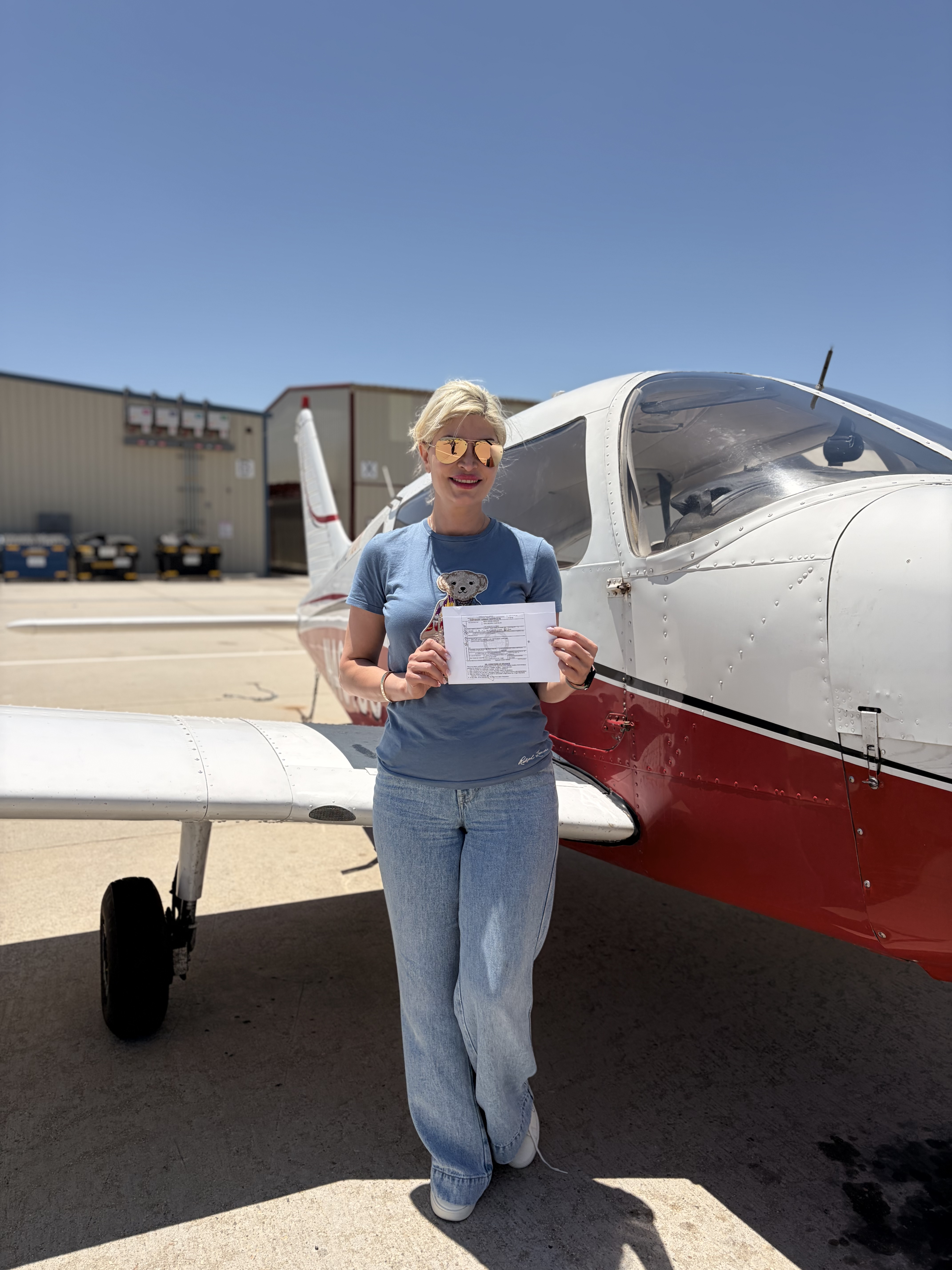 Shiva Kessler celebrating her instrument rating checkride pass at ActivePILOT