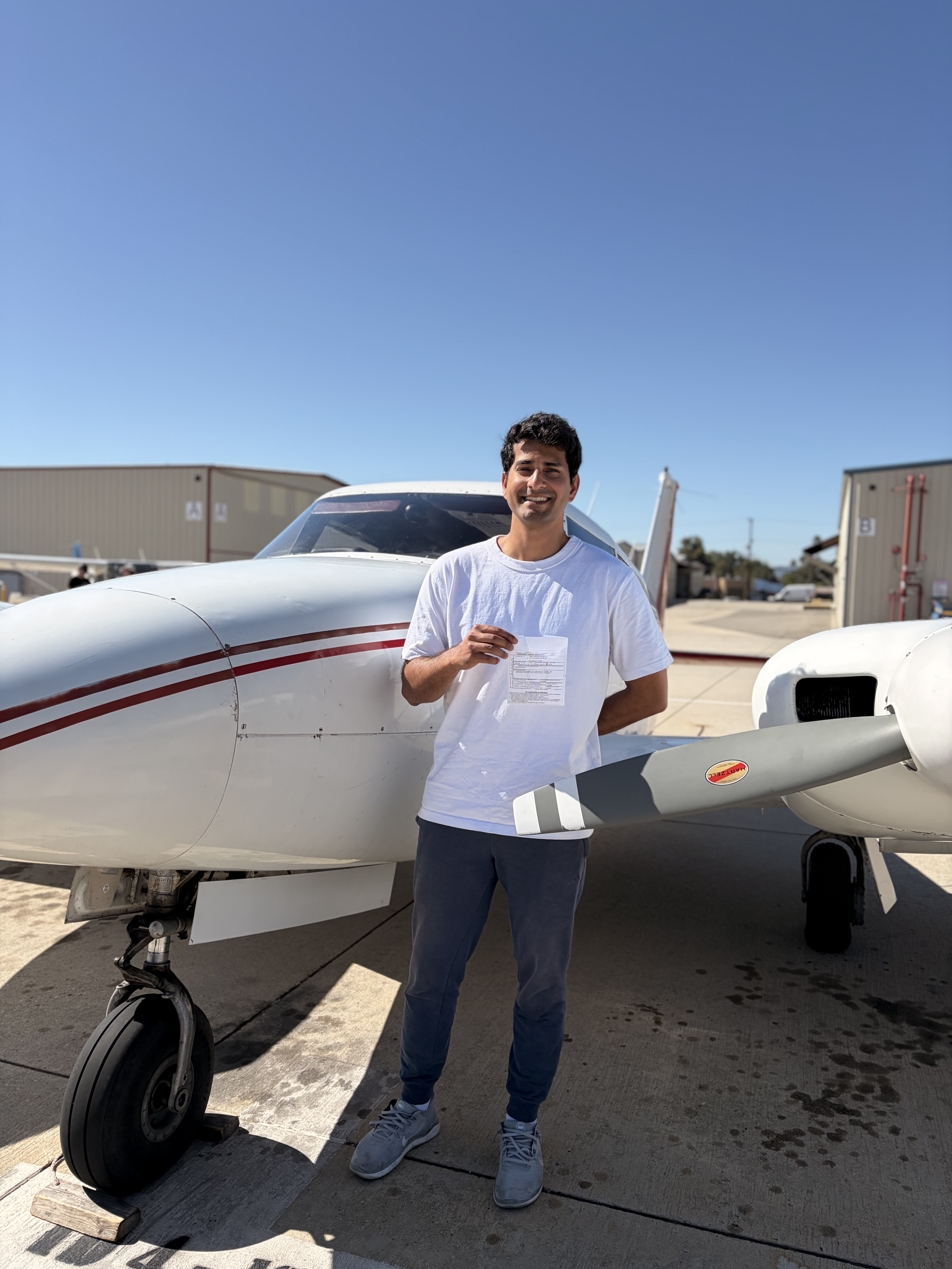 Srikar Kuchibhotla celebrating his commercial multi-engine add-on checkride pass at ActivePILOT