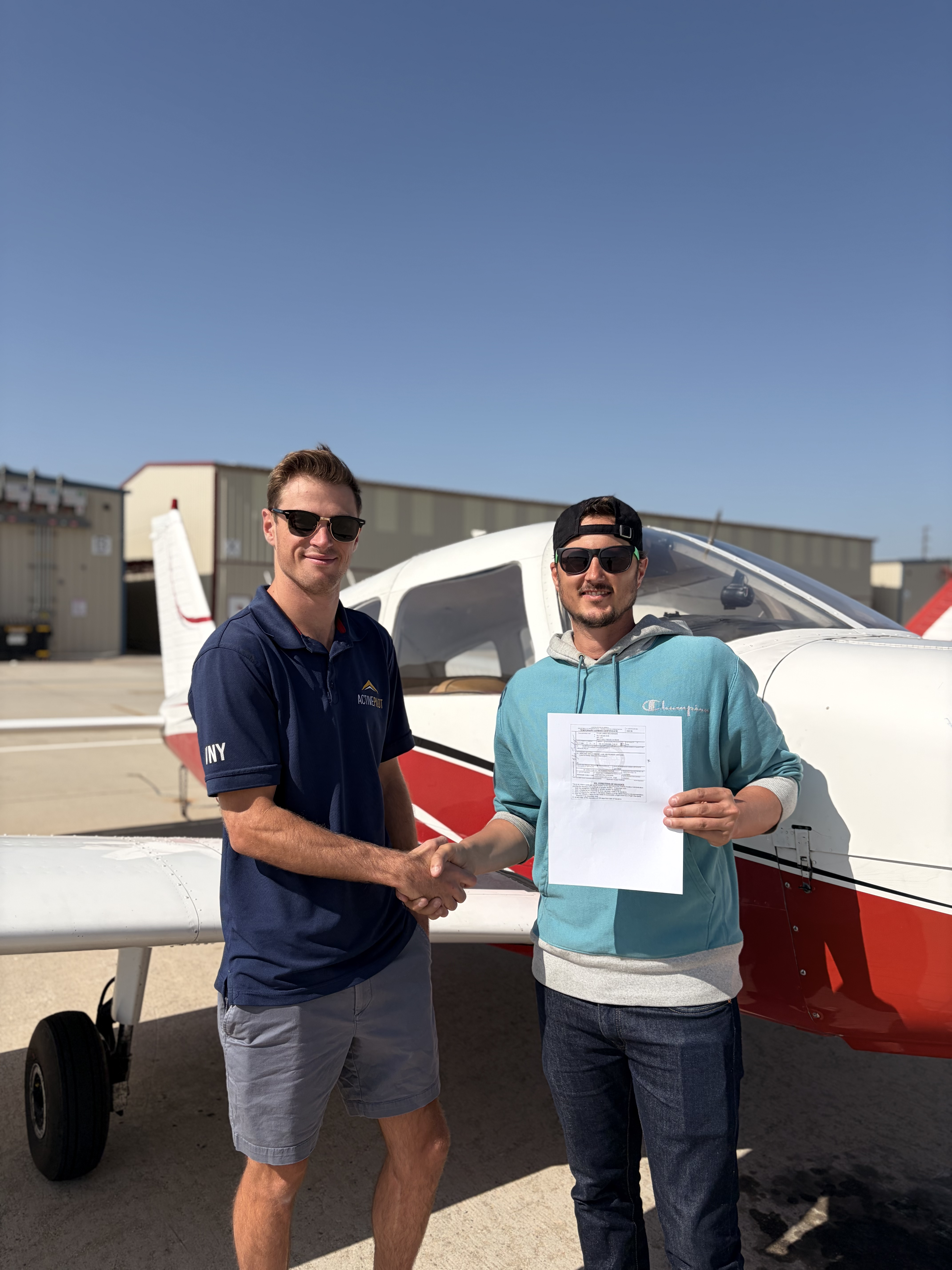 Tyler Neuhenguen celebrating his instrument rating checkride pass at ActivePILOT