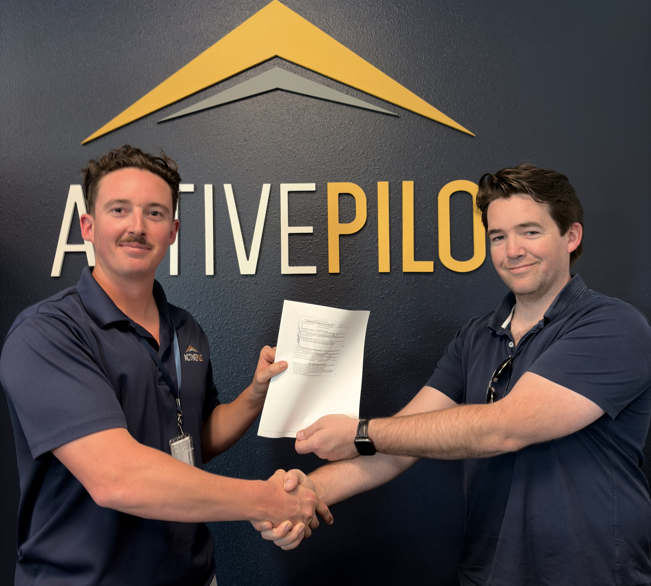Student pilot celebrating shaking hands with CFI after first discovery flight at ActivePILOT