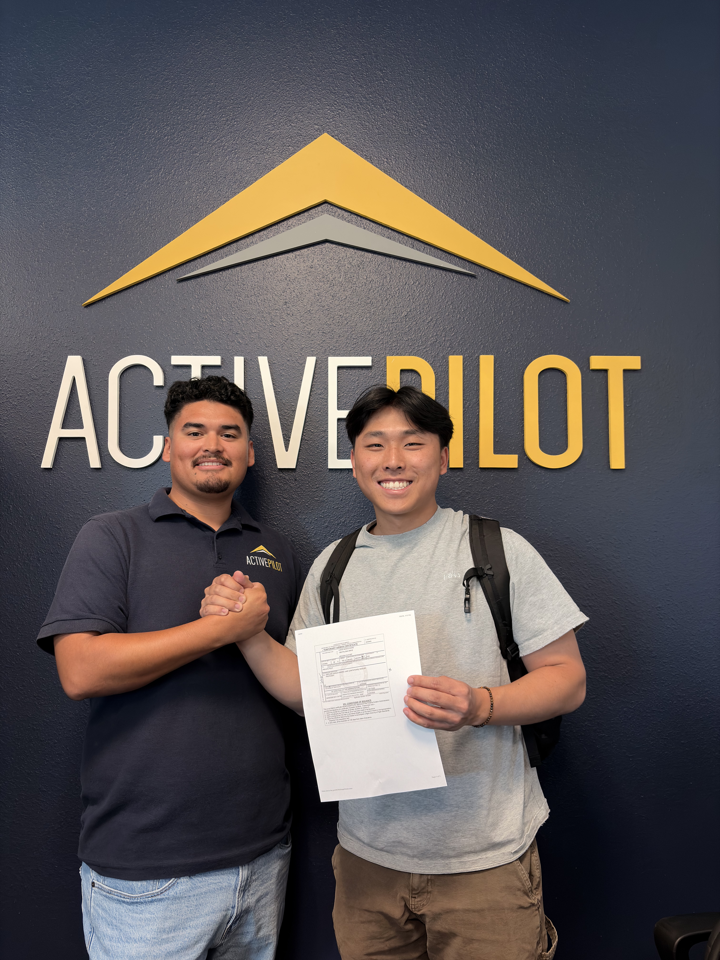 Lance Wong celebrating his private pilot checkride pass at ActivePILOT