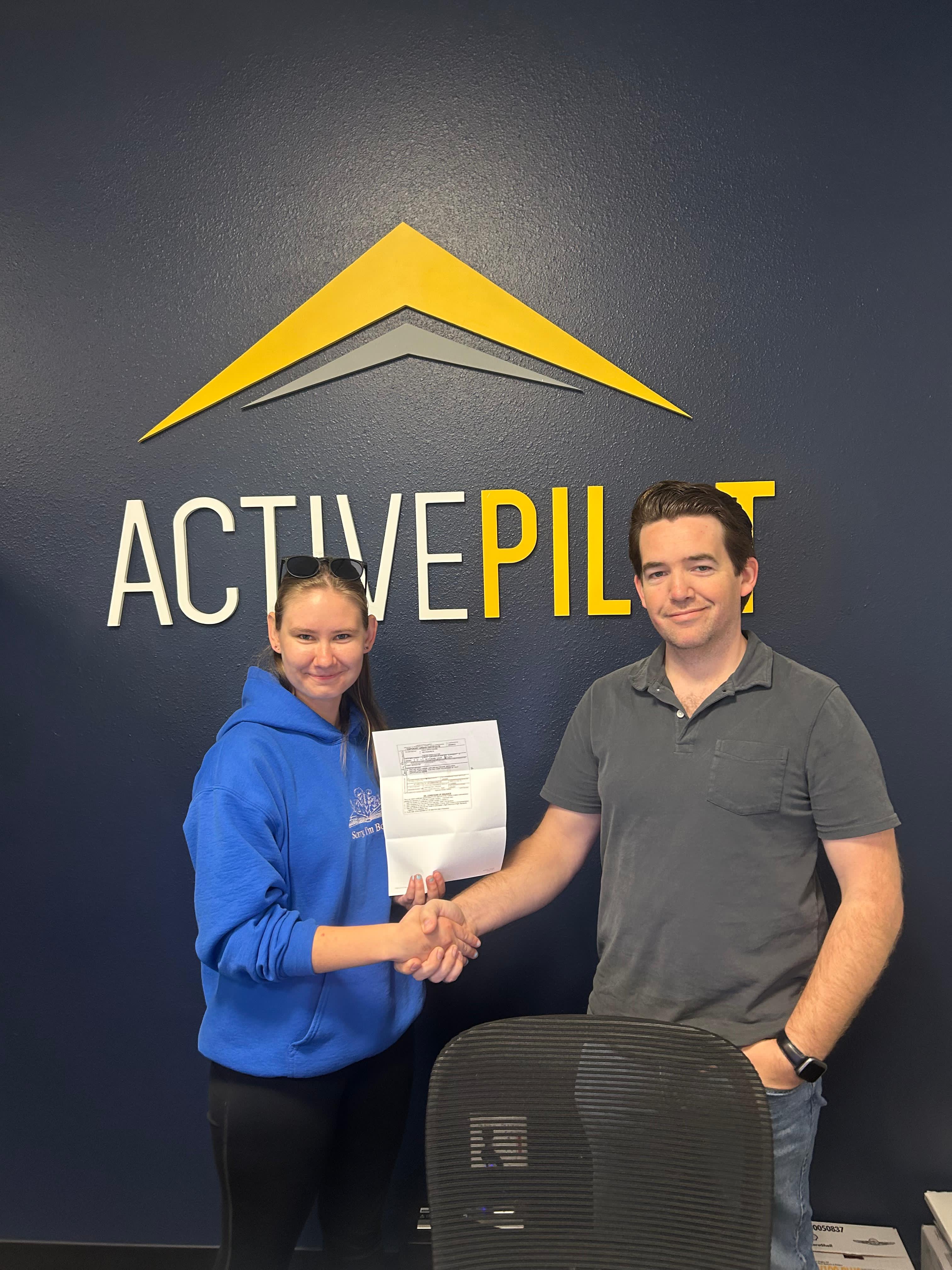 Caelia Moore celebrating a multi-engine instructor pass at ActivePILOT