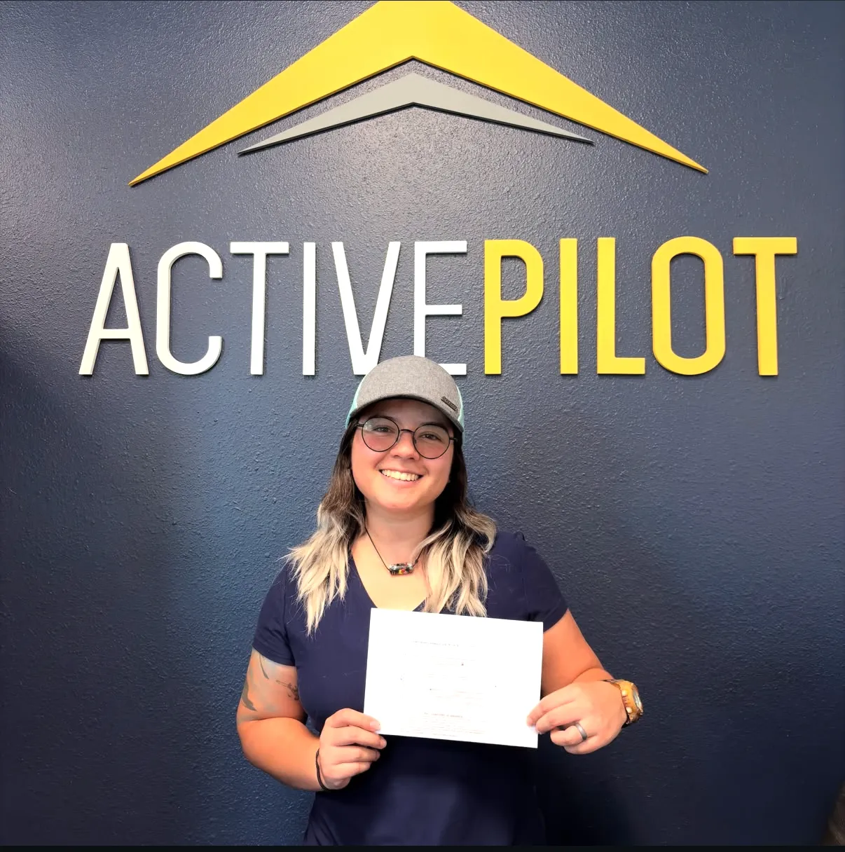 Maja Blackwood celebrating her commercial multi-engine add-on checkride pass at ActivePILOT