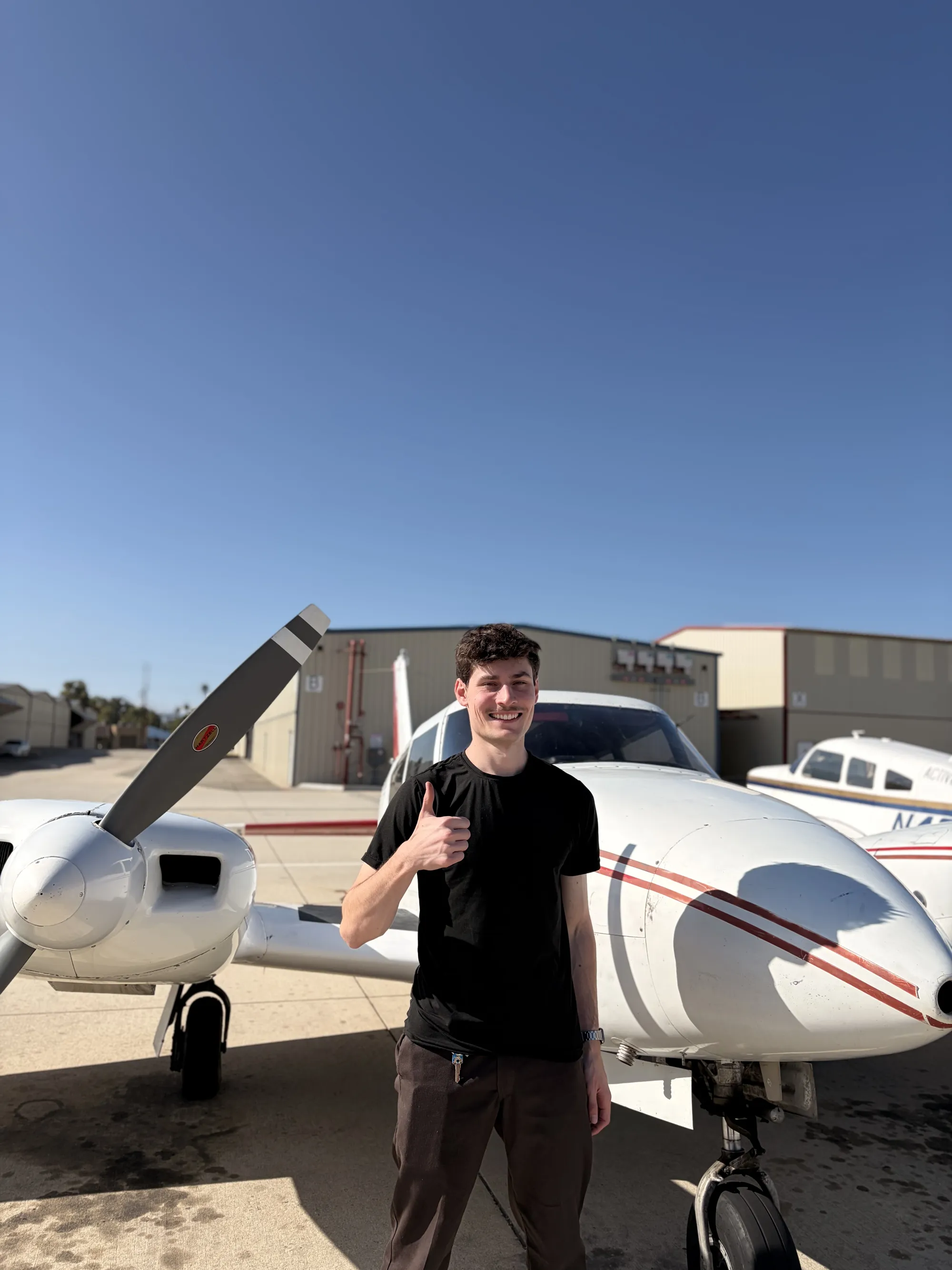 Max Podlubnyy celebrating his commercial multi-engine add-on checkride pass at ActivePILOT