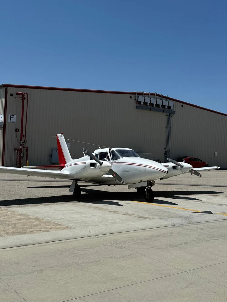 Piper Twin Comanche N7738Y parked on the ramp at Van Nuys Airport